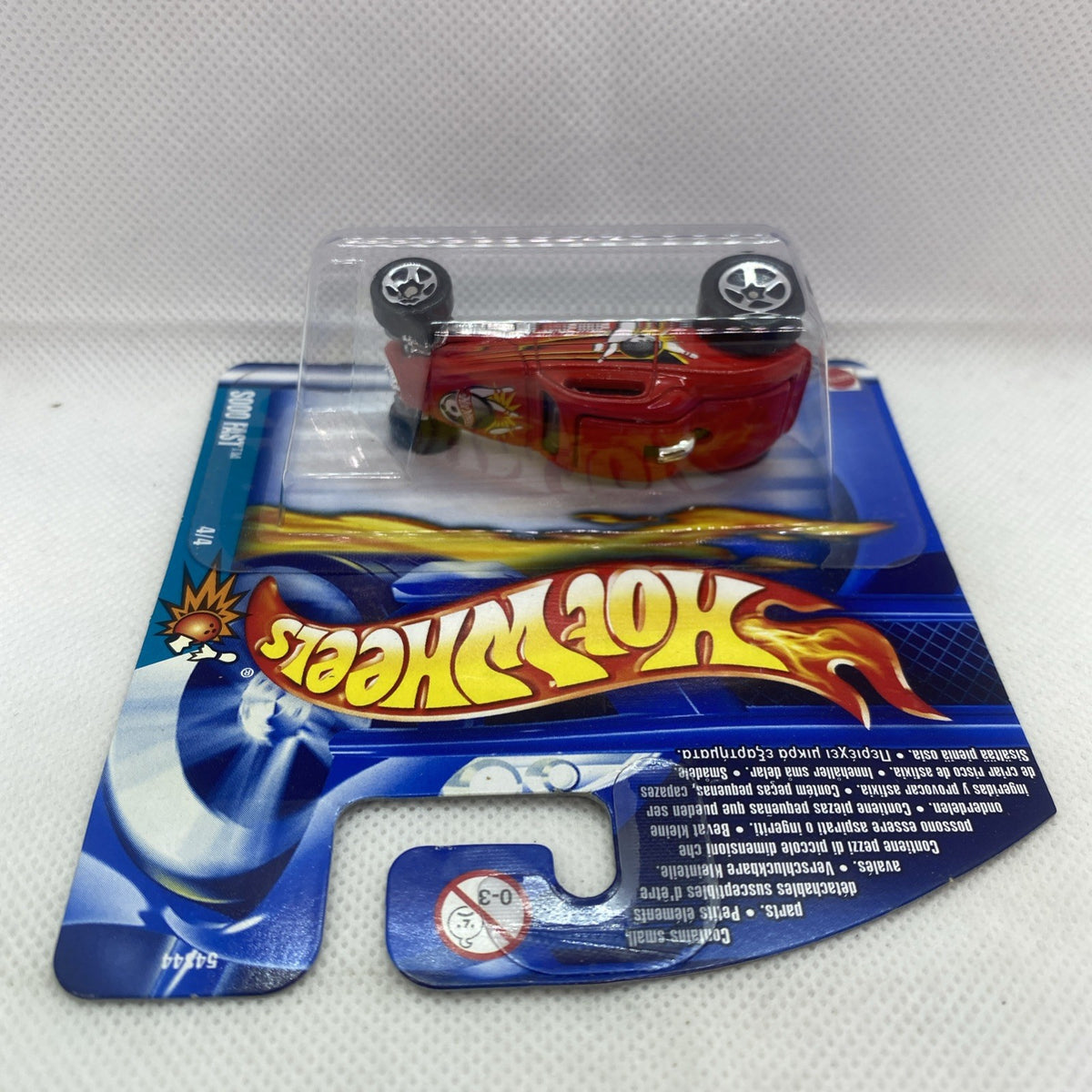 Hot Wheels die-cast red car in clear blister on blue card backing