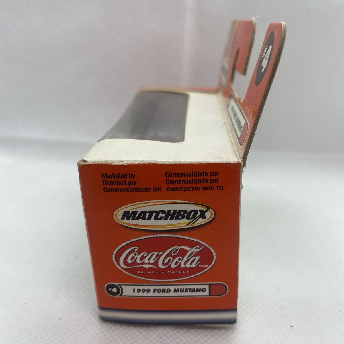 Orange Matchbox boxed die-cast Ford Mustang #4 Coca-Cola car, front corner view