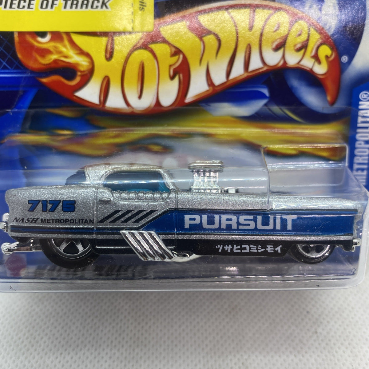 Hot Wheels die-cast car close-up in blister, silver Nash Metropolitan “Pursuit”