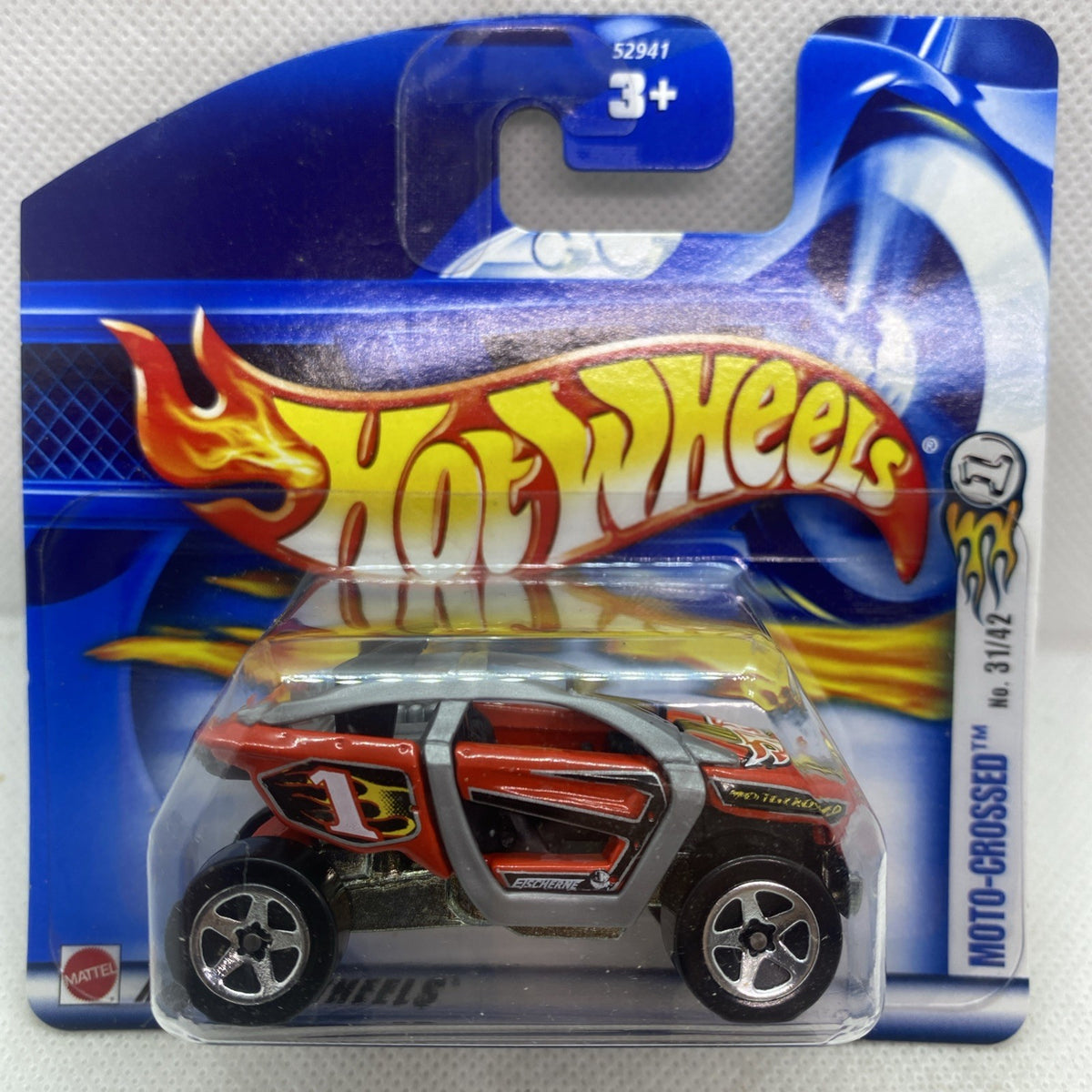 Hot Wheels die-cast motocross car in blue blister pack with flame graphics, age 3+