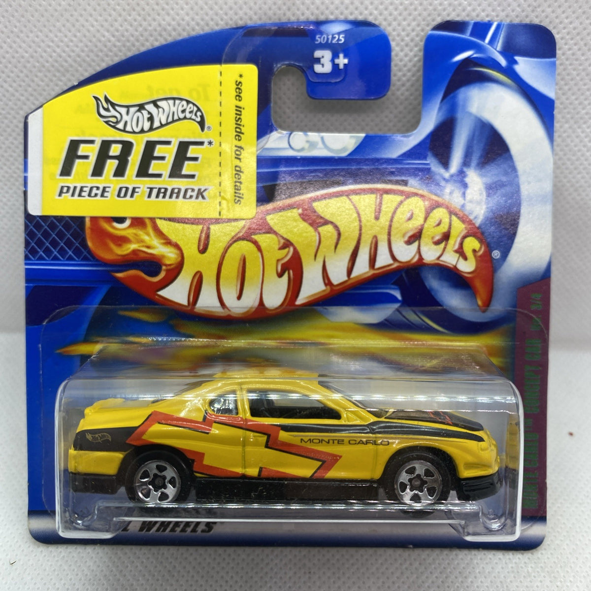 Hot Wheels Monte Carlo concept die-cast car in yellow blister package, front view