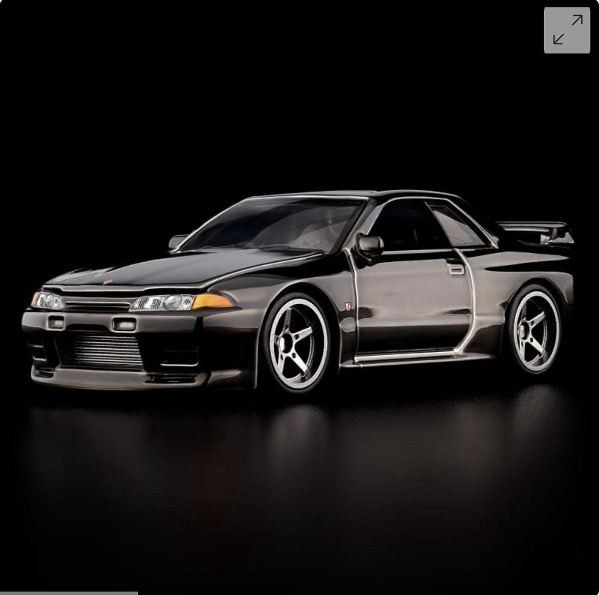 RLC Nissan Skyline GT-R model car in gray, side 3/4 view, hood closed