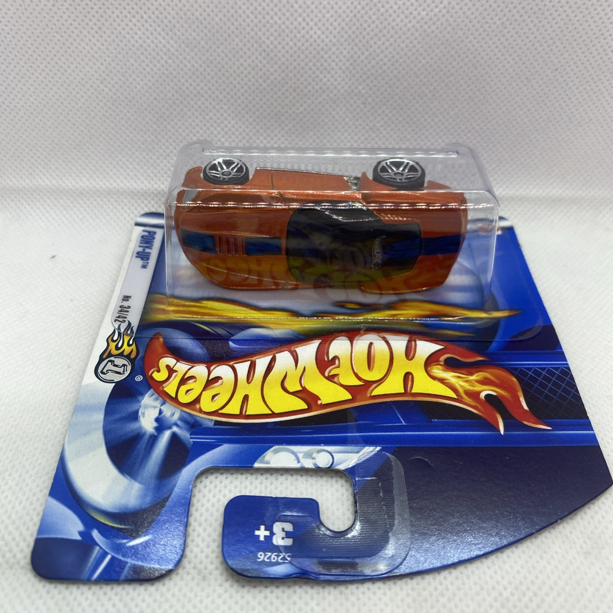Hot Wheels Pony-Up orange die-cast car in clear blister, rear view