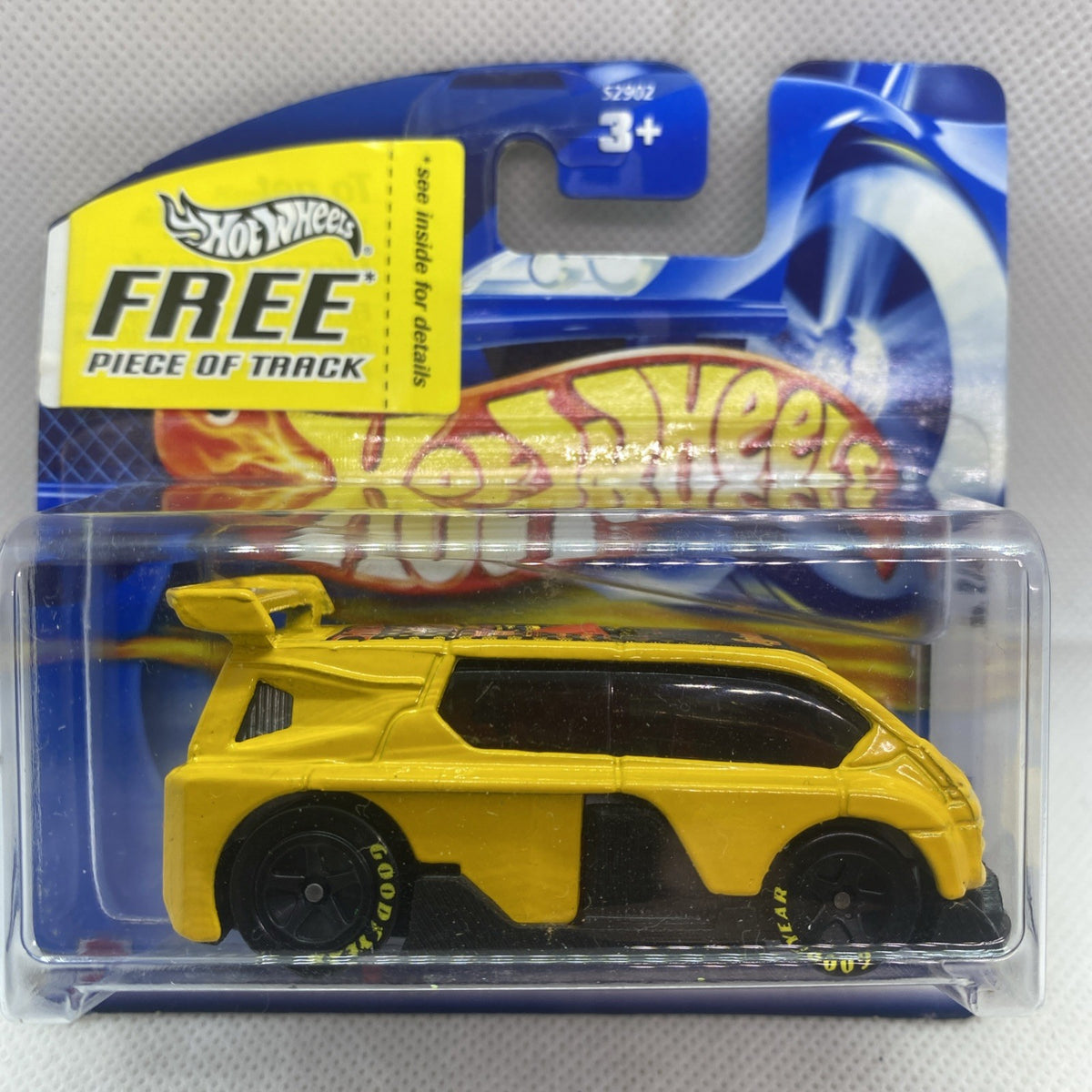 Hot Wheels yellow die-cast car in blue blister pack, carded collectible