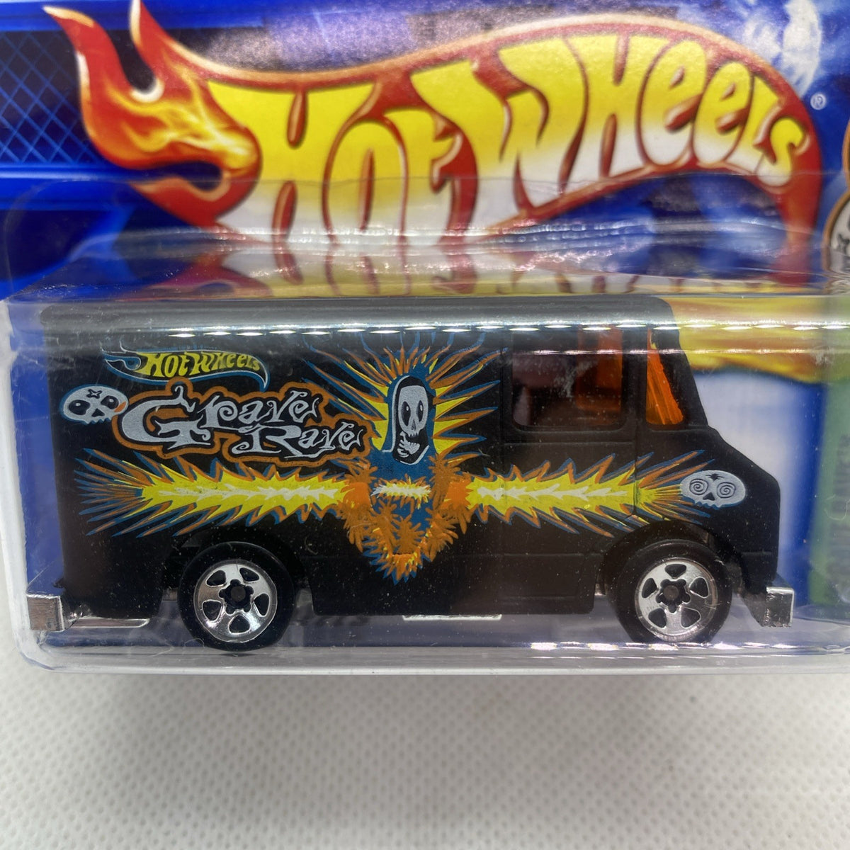 Hot Wheels Grave Rave die-cast car in blister pack, black with orange flame design