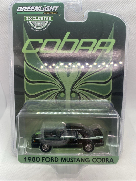 Die-cast 1980 Ford Mustang Cobra model car in green blister package