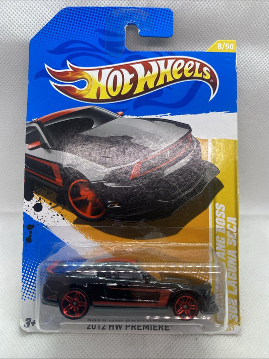 Hot Wheels HW Premiere die-cast car on card, black body with red wheels