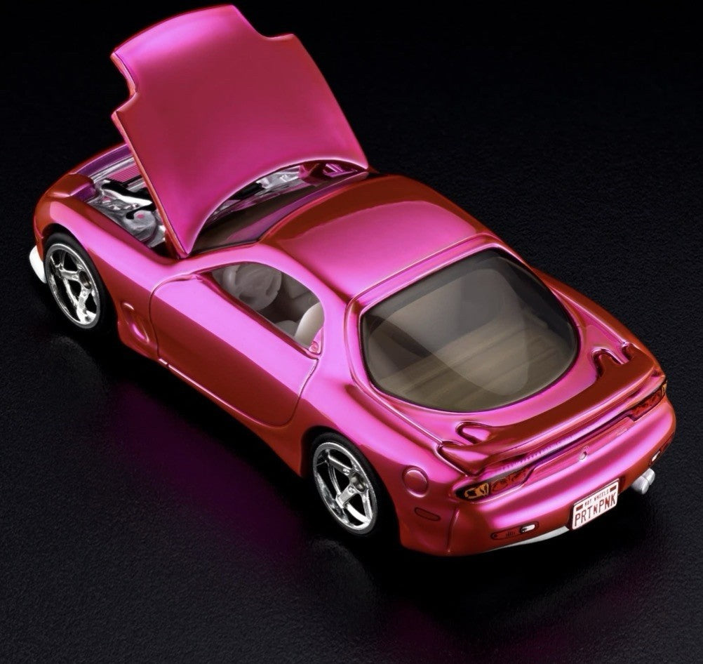 Pink and orange die-cast sports car with hood open and chrome wheels