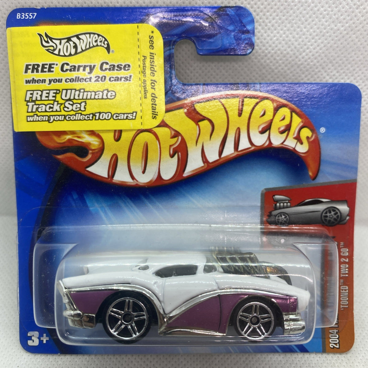 White and purple die-cast car in clear Hot Wheels blister on blue card backing