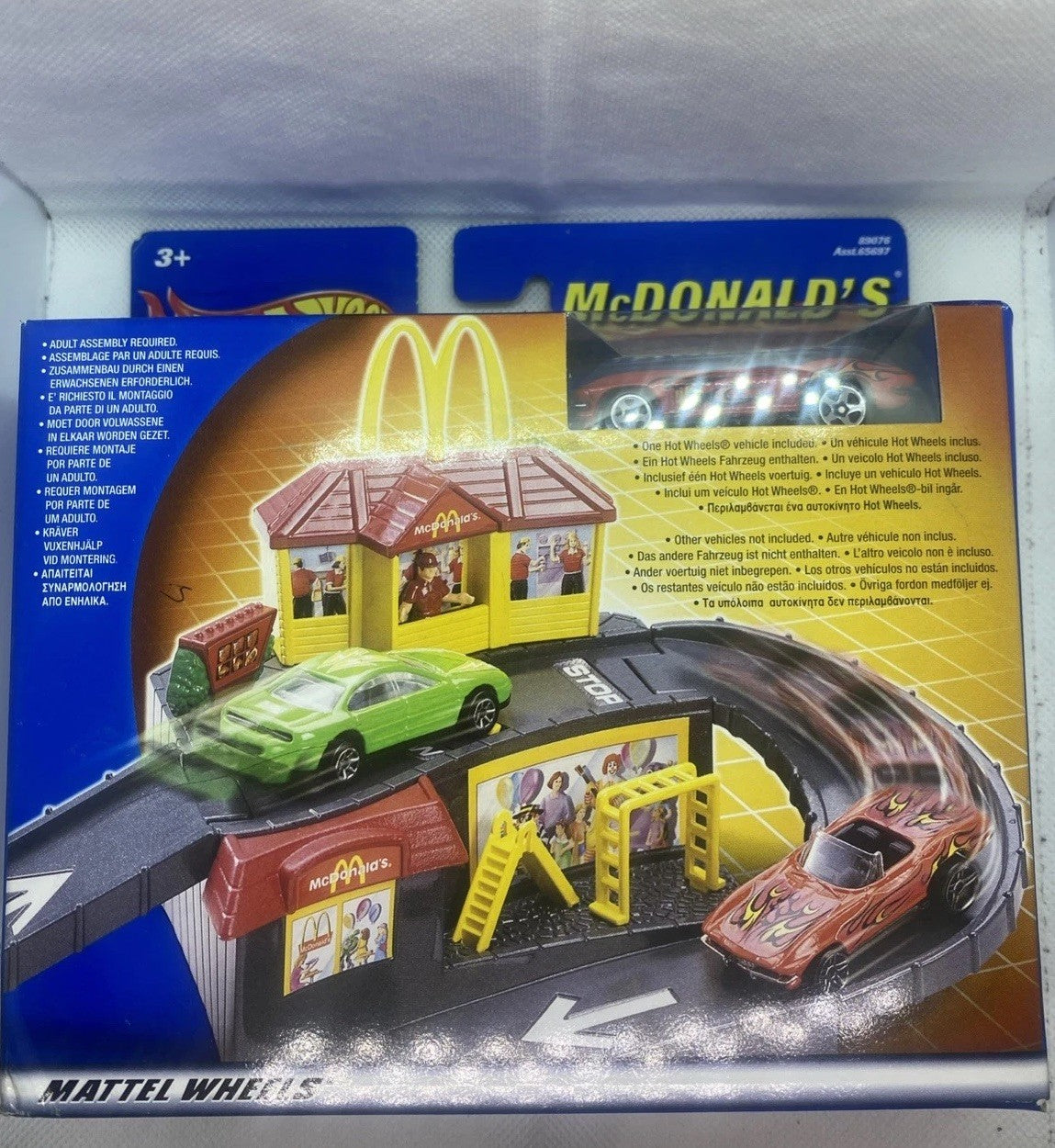 Hot Wheels McDonald's track playset in retail box with cars and fast-food buildings