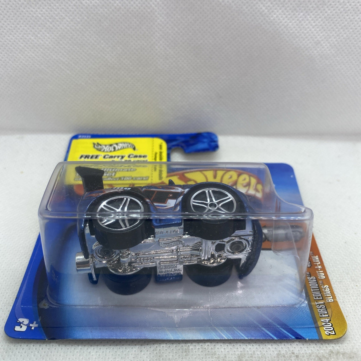 Hot Wheels die-cast car in blister with exposed engine and large chrome wheels