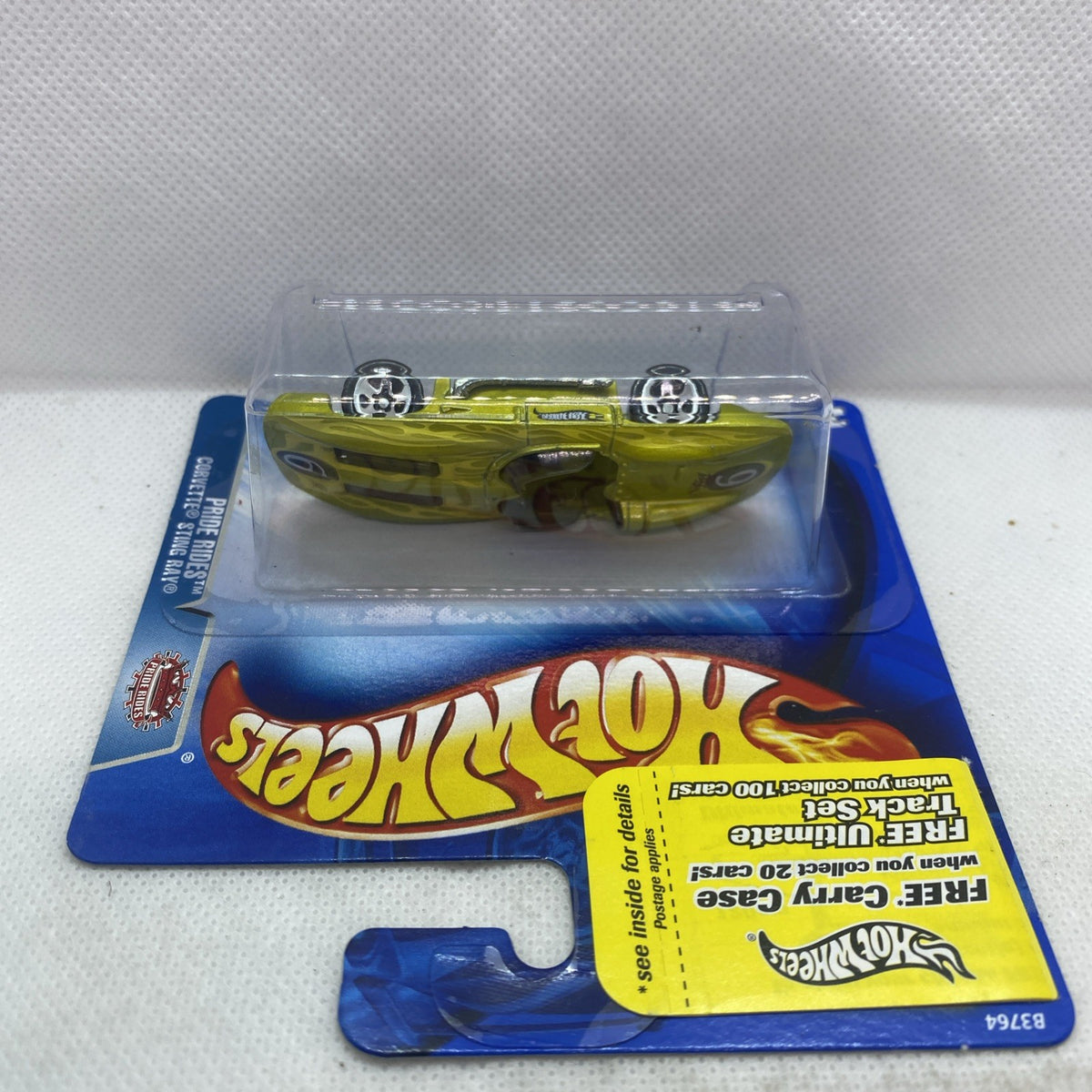 Hot Wheels lime green Corvette Sting Ray die-cast car in blister on blue card