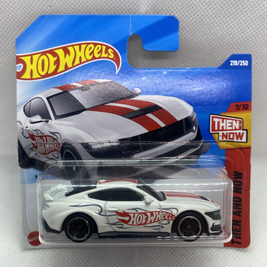 Hot Wheels Ford Mustang toy car in clear blister, white with red stripes, black wheels