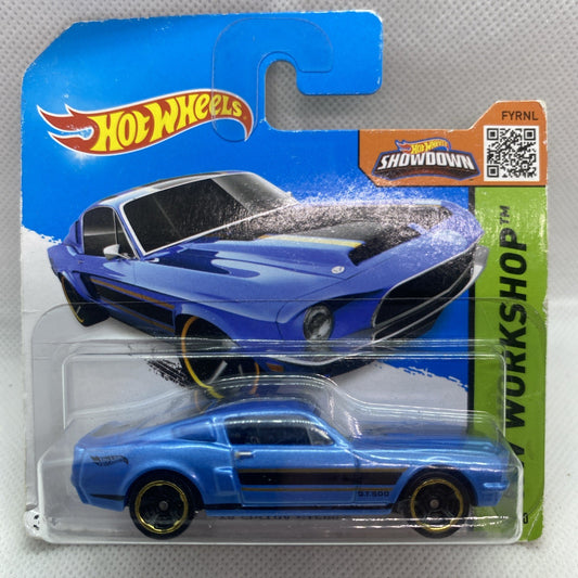 Blue die-cast coupe car in Hot Wheels blister card, shows front view