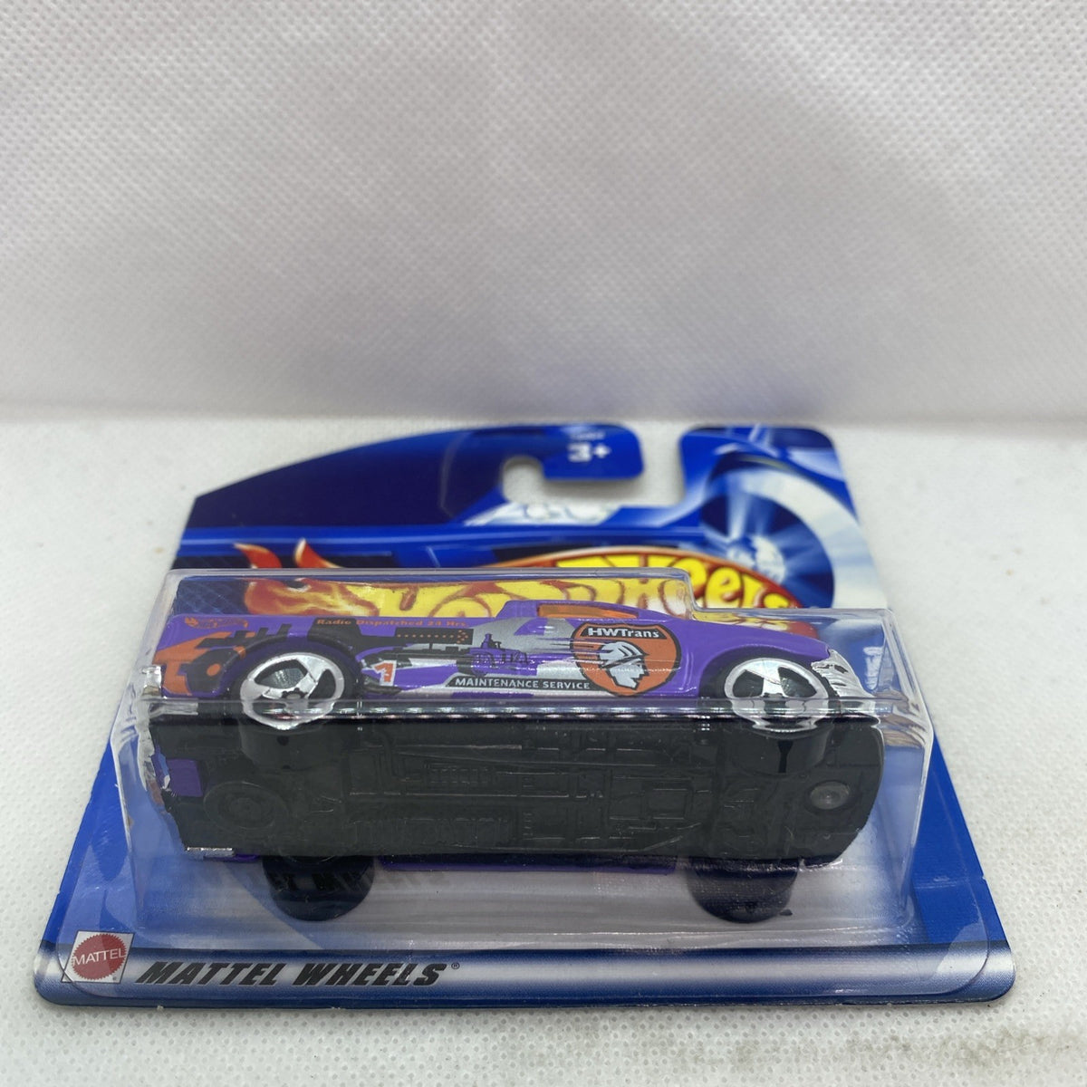 Hot Wheels purple 2002 Ford F-150 blister, rear three-quarter view, black wheels