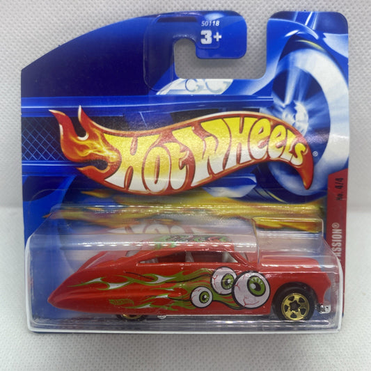 Hot Wheels card with clear blister, red monster car with green flame graphics and big eye decals