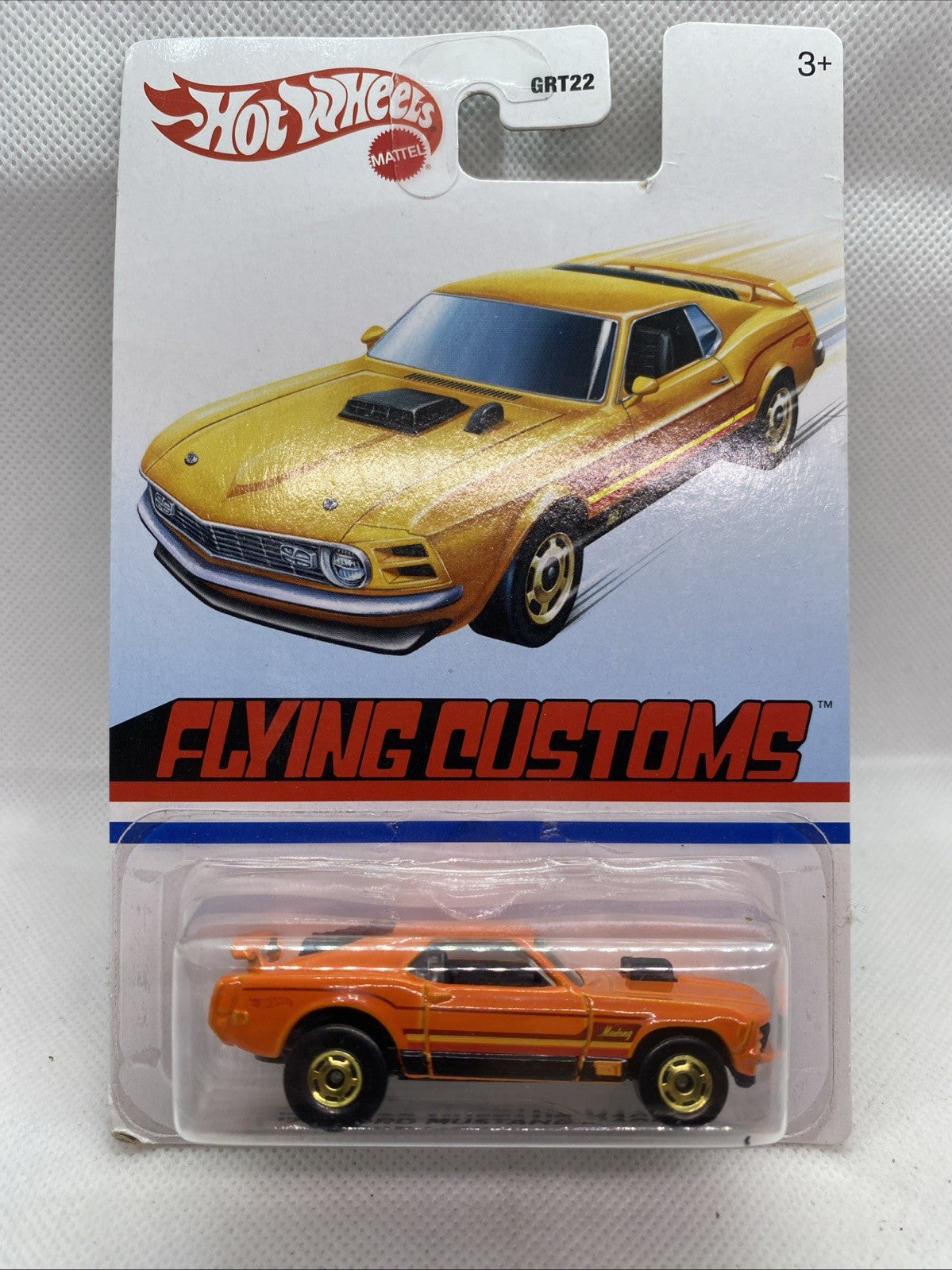 Hot Wheels '70 Ford Mustang Mach 1 die-cast, orange car in clear Flying Customs blister card