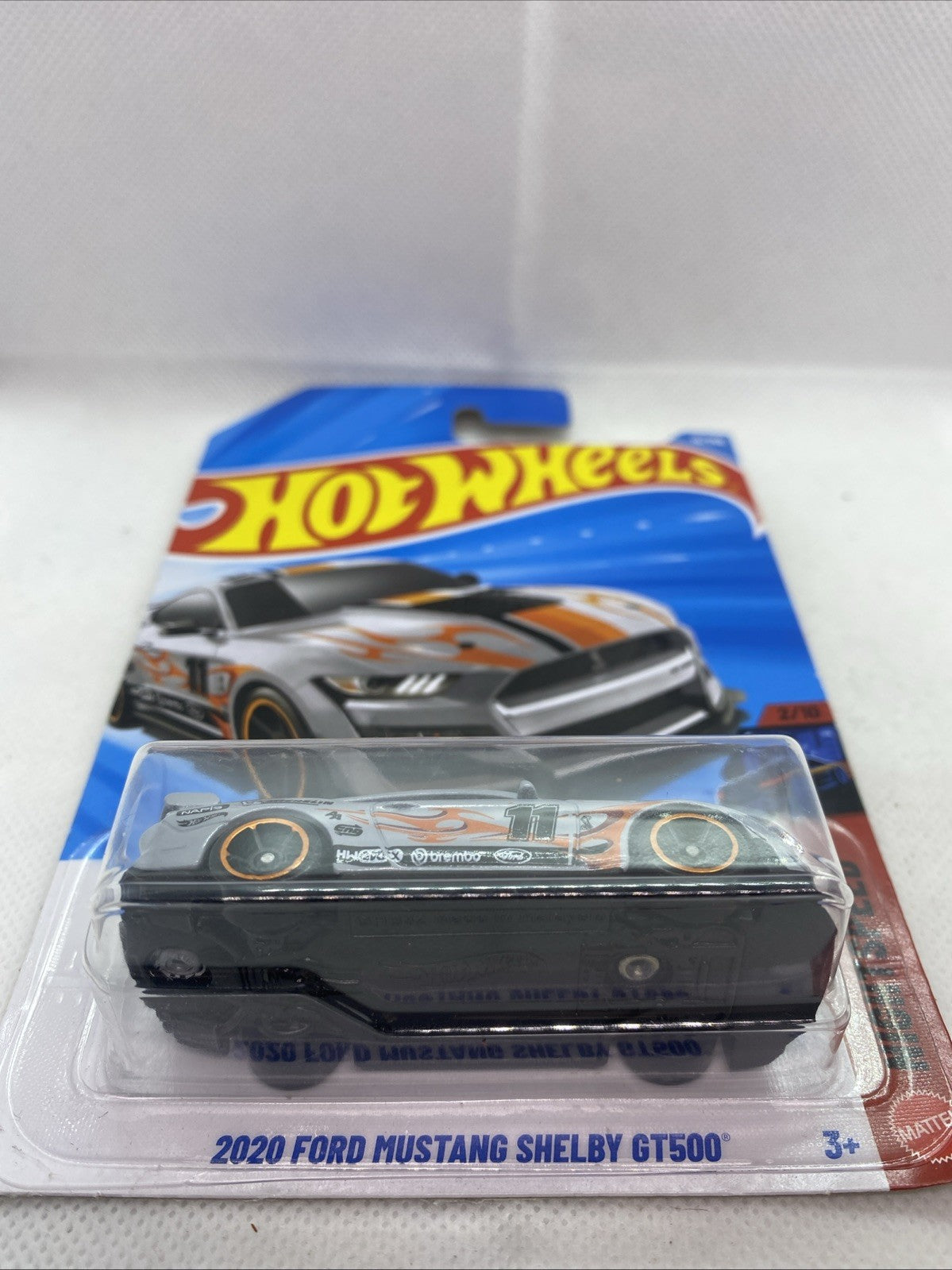 Hot Wheels die-cast car in clear blister card, front view on retail packaging