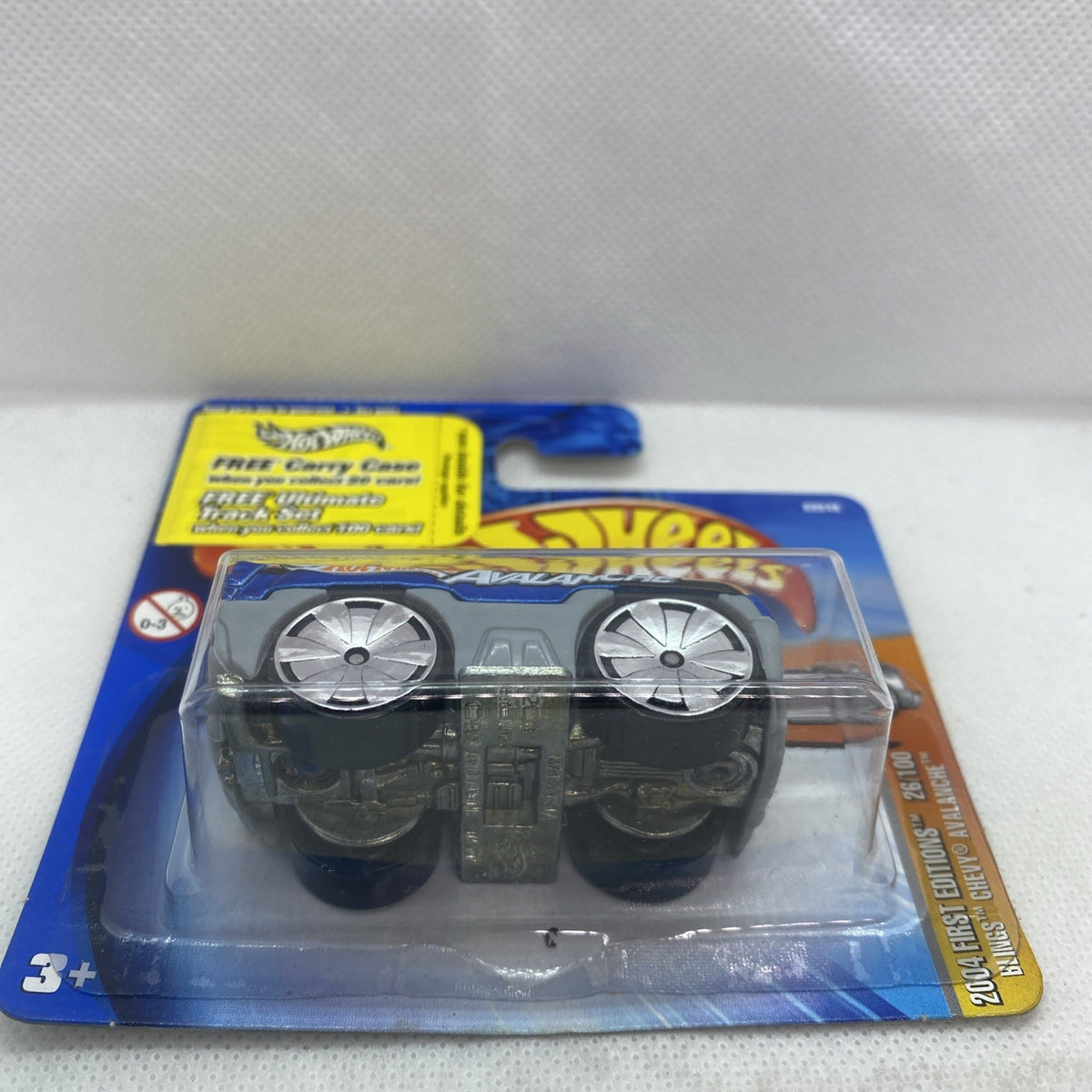 Hot Wheels die-cast pickup car front view in blister pack, blue body with chrome wheels
