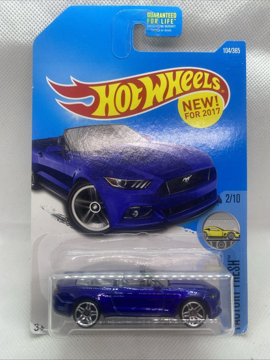 Hot Wheels die-cast toy car in blue blister package, front view of convertible