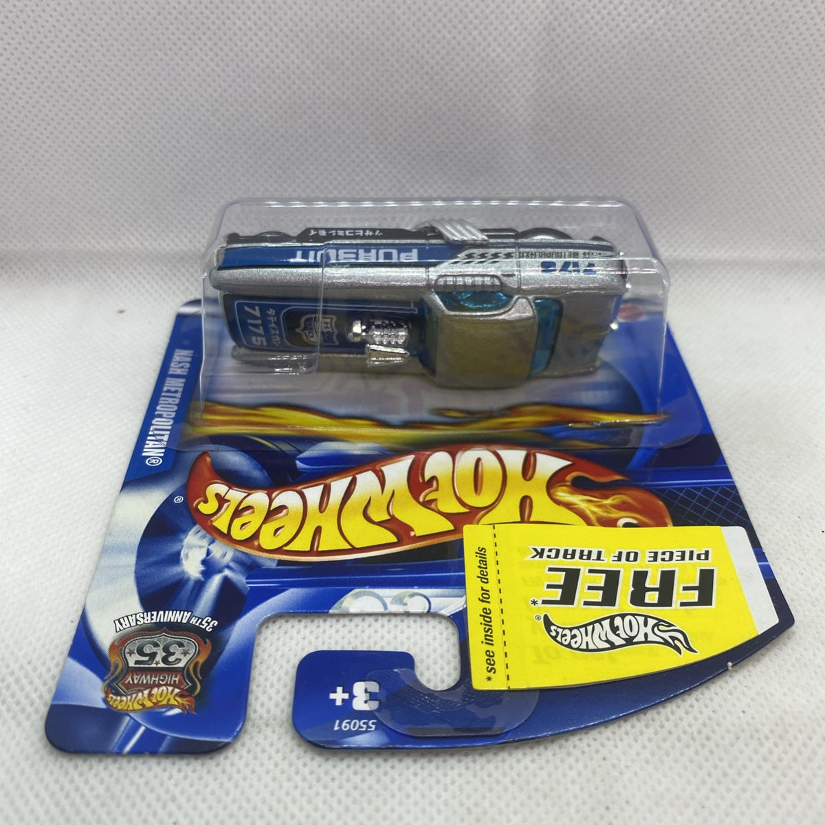 Hot Wheels die-cast car in blister, top-front view, silver with “Pursuit”