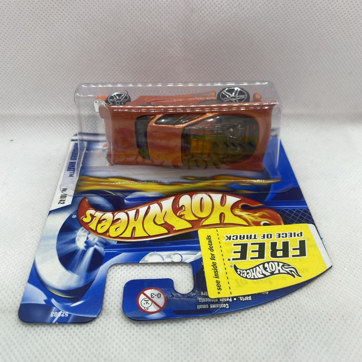 Hot Wheels short card packaging with sealed blister and orange-brown flame die-cast car