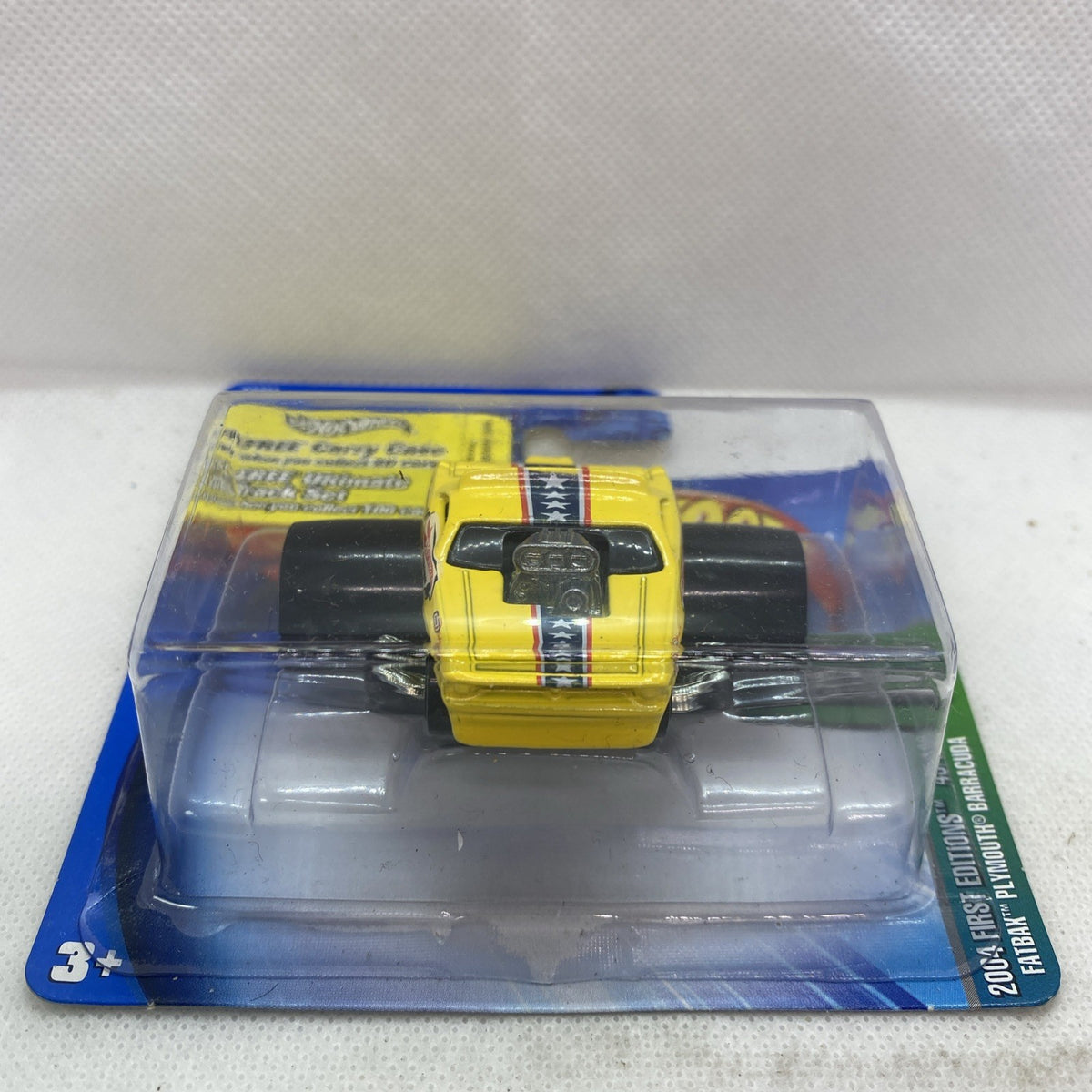 Hot Wheels yellow die-cast Plymouth Barracuda in clear blister on short card, front view