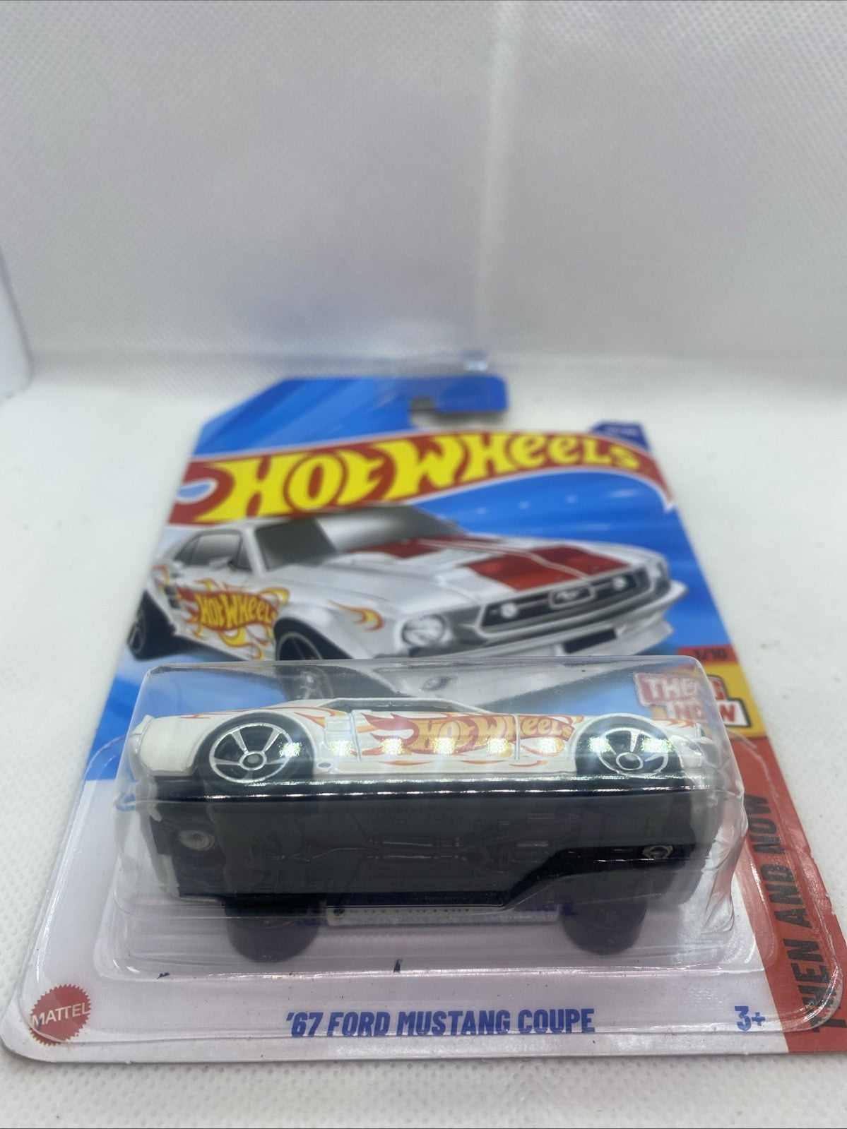 Hot Wheels die-cast car in clear blister pack, front view with “Then and Now” badge