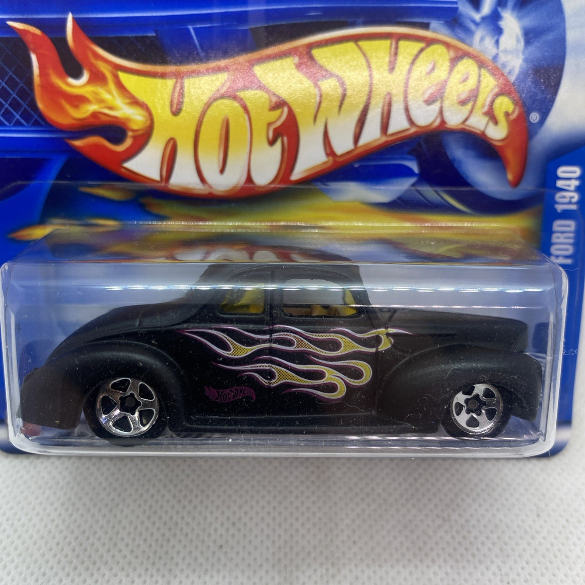 Black 1940 Ford Coupe toy car close-up in sealed Hot Wheels blister pack
