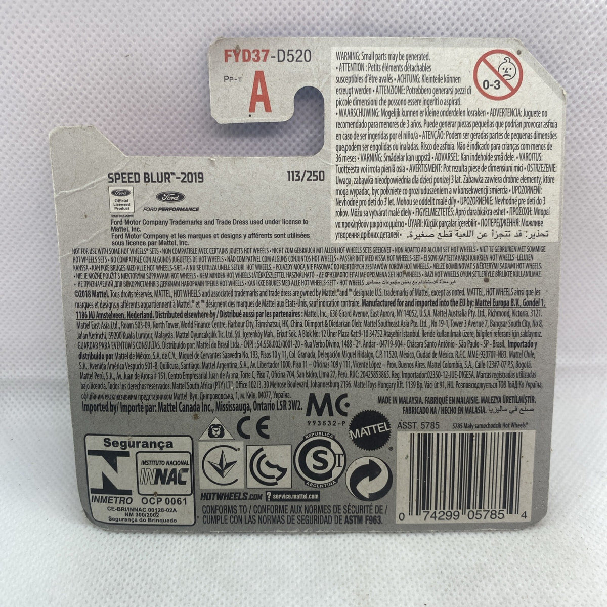 Hot Wheels Speed Blur card back with printed specs, barcode, and safety icons.
