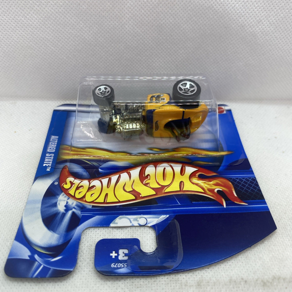 Hot Wheels Rat Trap die-cast car in clear blister, yellow body and black wheels