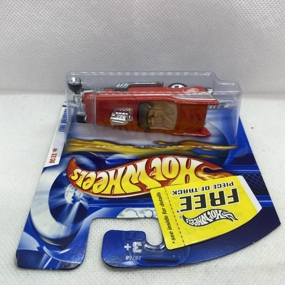 Hot Wheels ’57 Roadster red die-cast car in clear blister packaging