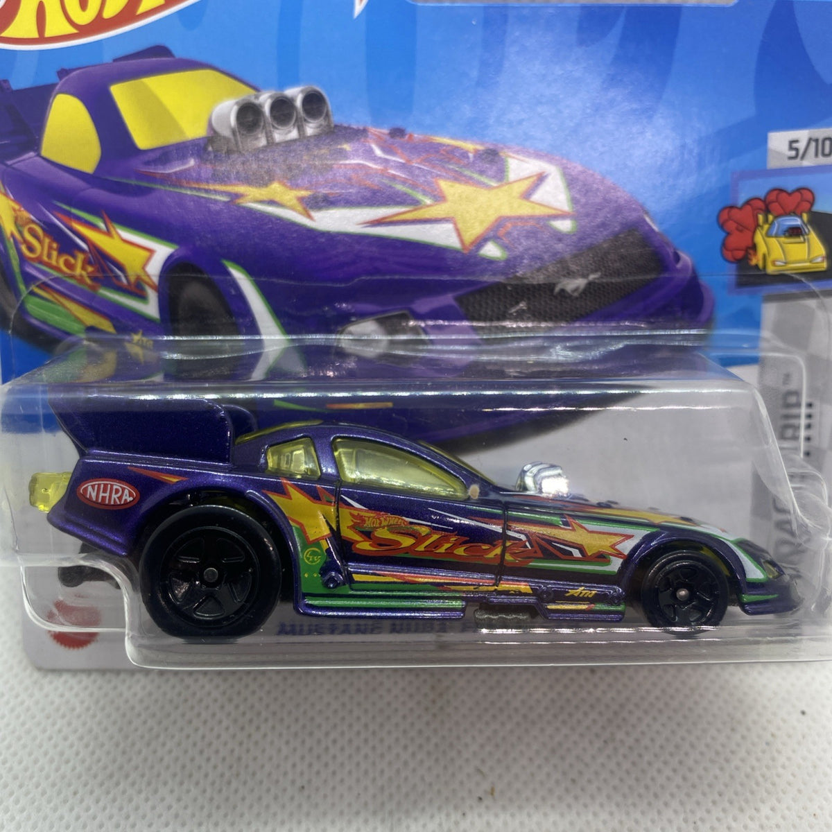 Hot Wheels NHRA Funny Car die-cast close-up in clear blister, purple body and stars
