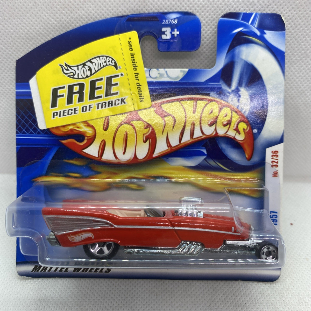 Red Hot Wheels ’57 Roadster die-cast car blister pack with “FREE piece of track”