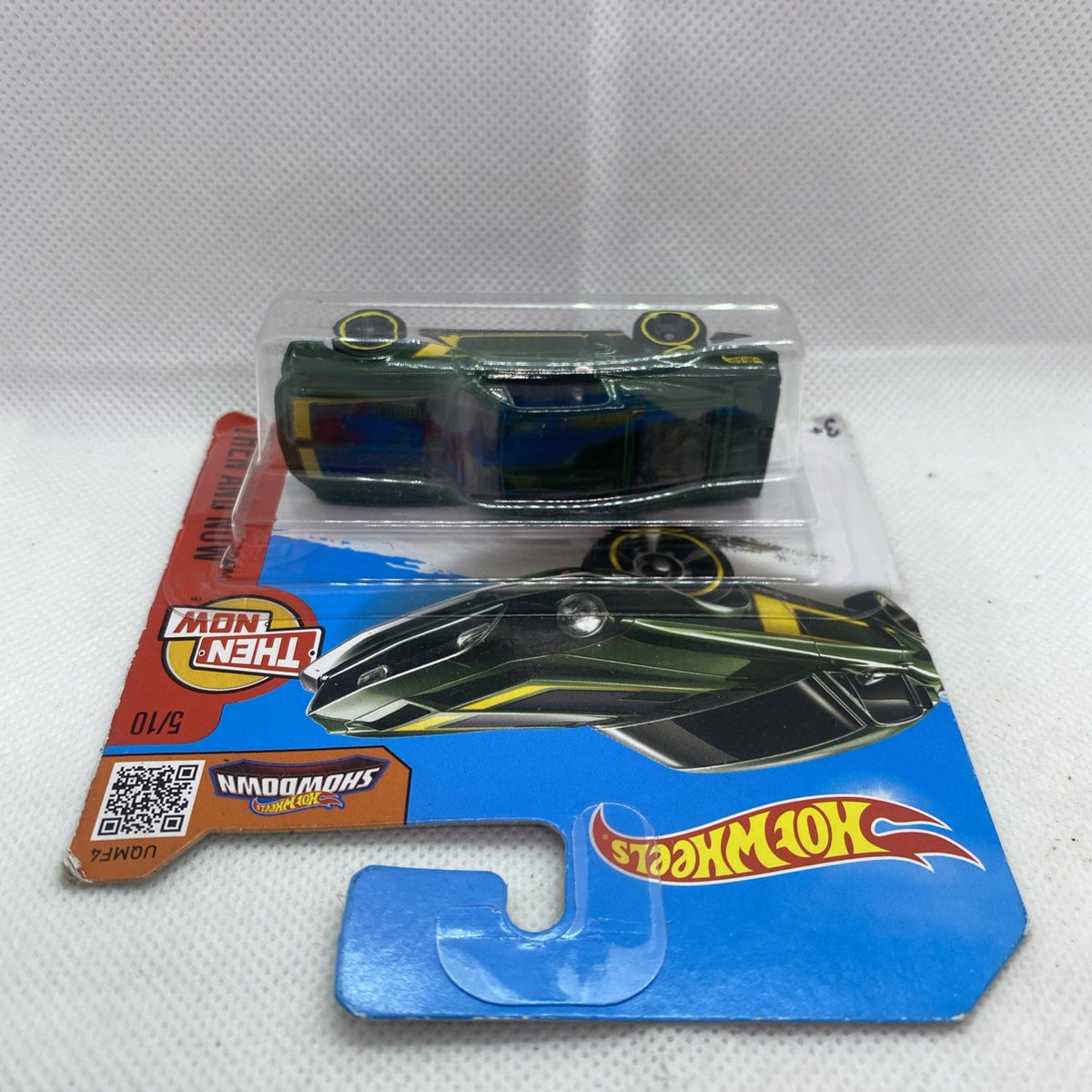 Hot Wheels green toy car in clear blister on blue and red card