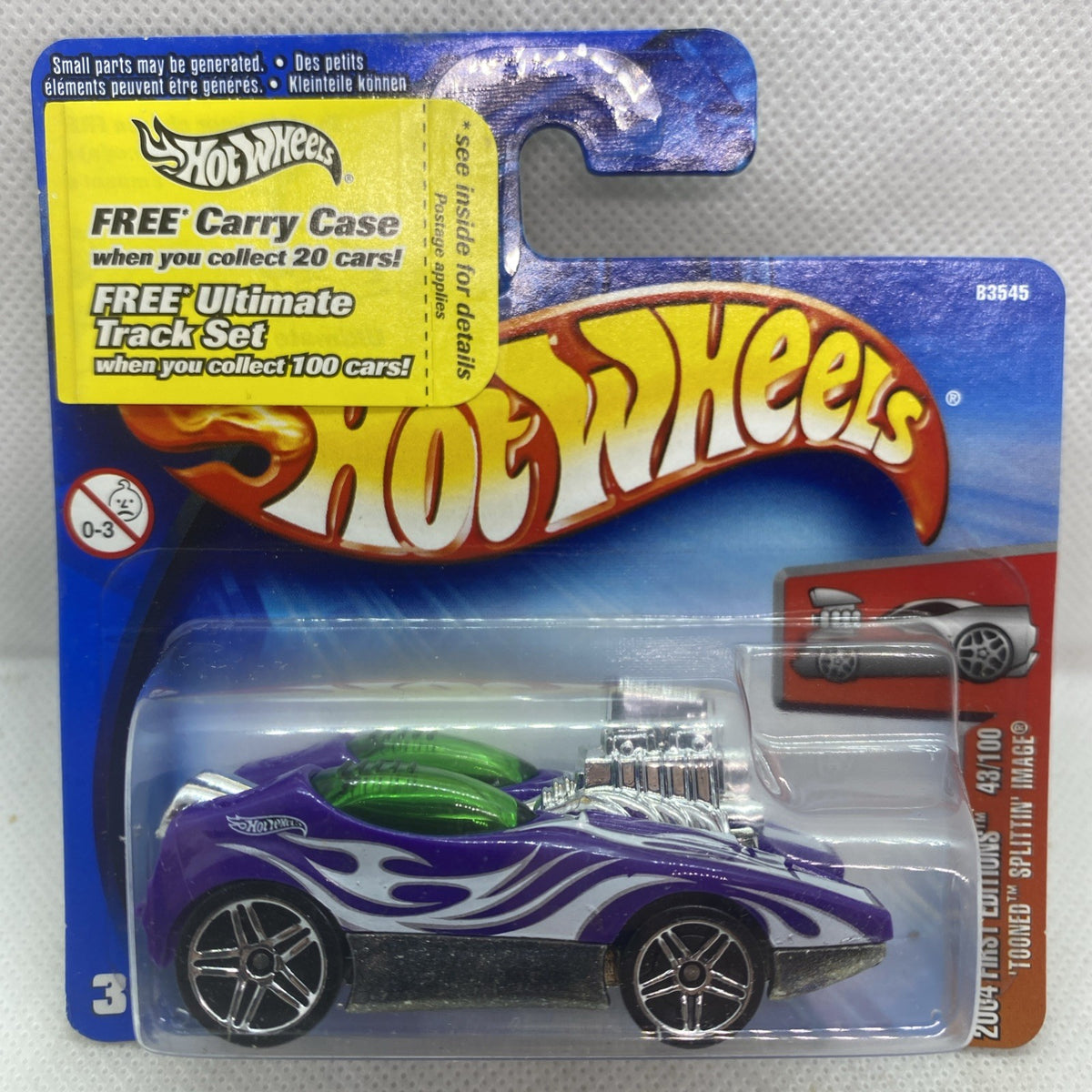 Hot Wheels die-cast car in purple with flame graphics, sealed on short card blister