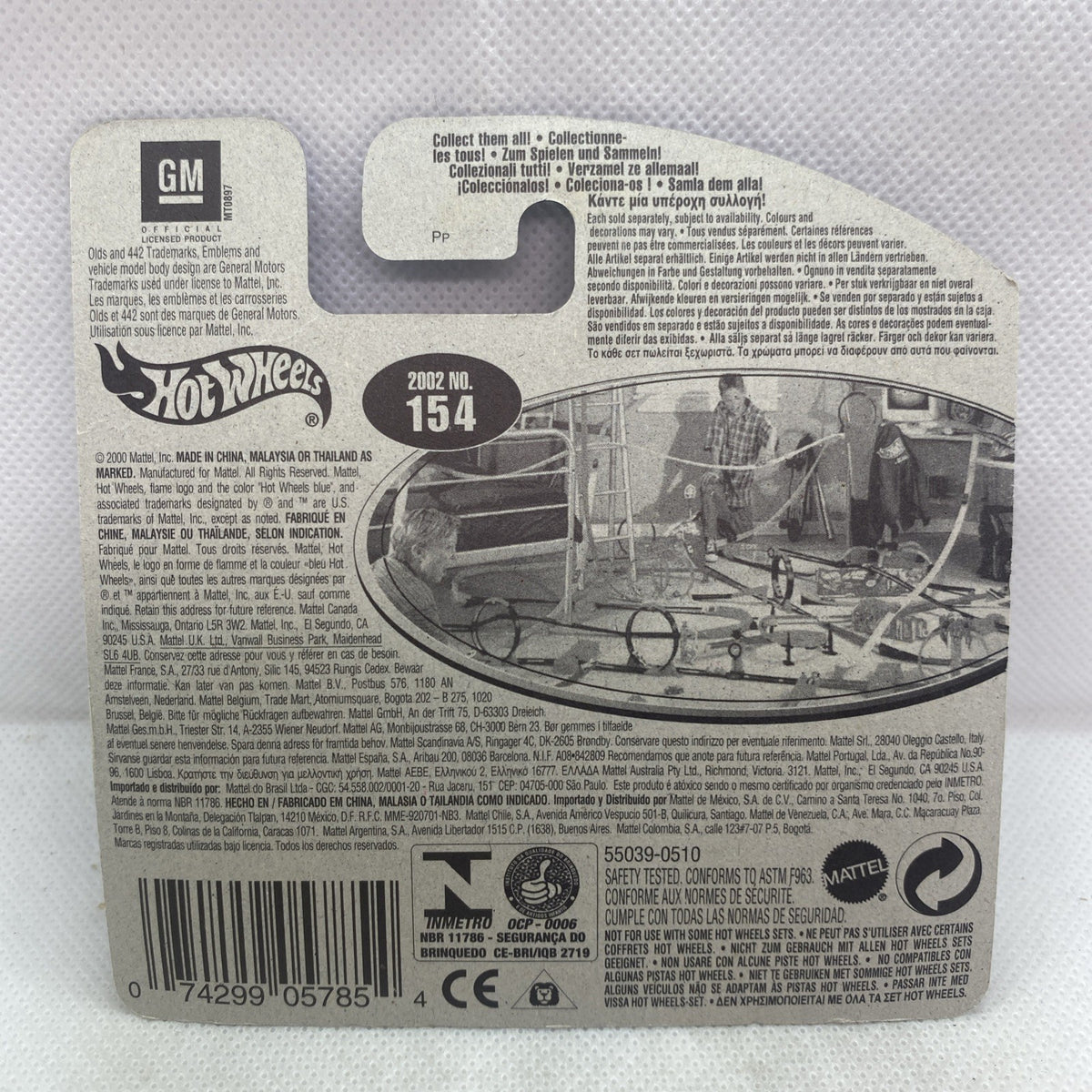 Hot Wheels die-cast car packaging back with GM text, barcode, and specs on card