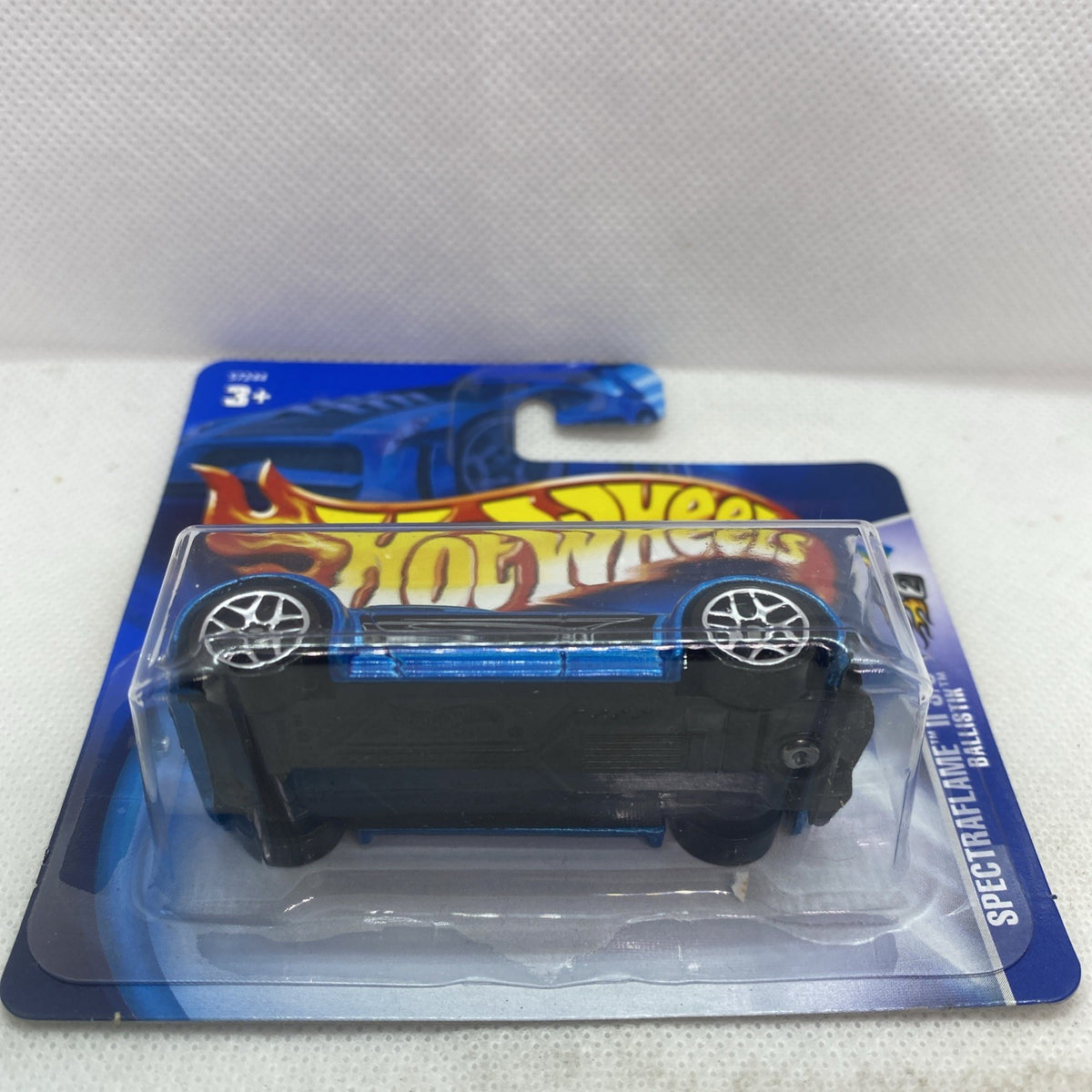 Hot Wheels Spectraflame II blue die-cast car in blister pack, side view