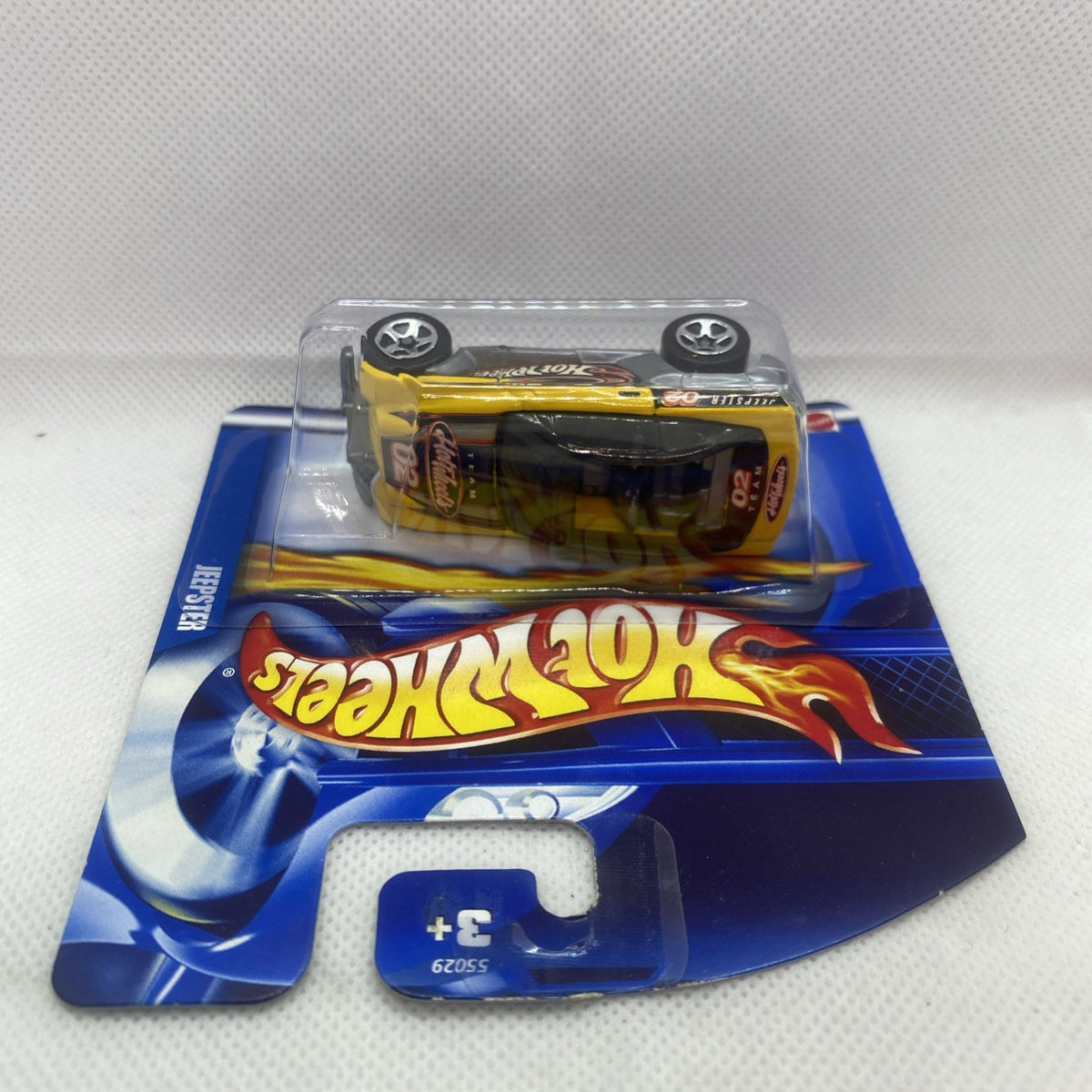 Hot Wheels Jeepster 2002 die-cast car on blue short-card blister packaging