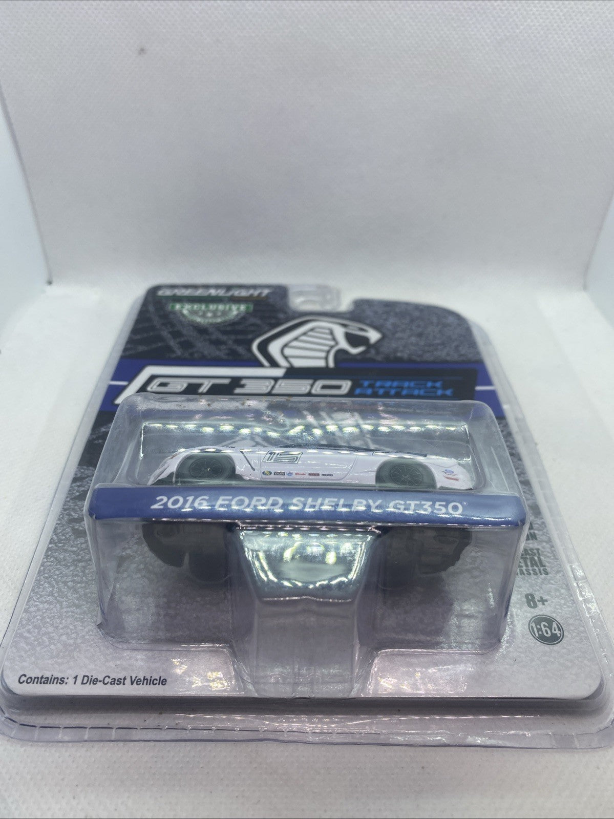 Sealed die-cast race car blister pack, white Ford Shelby with black wheels and front view