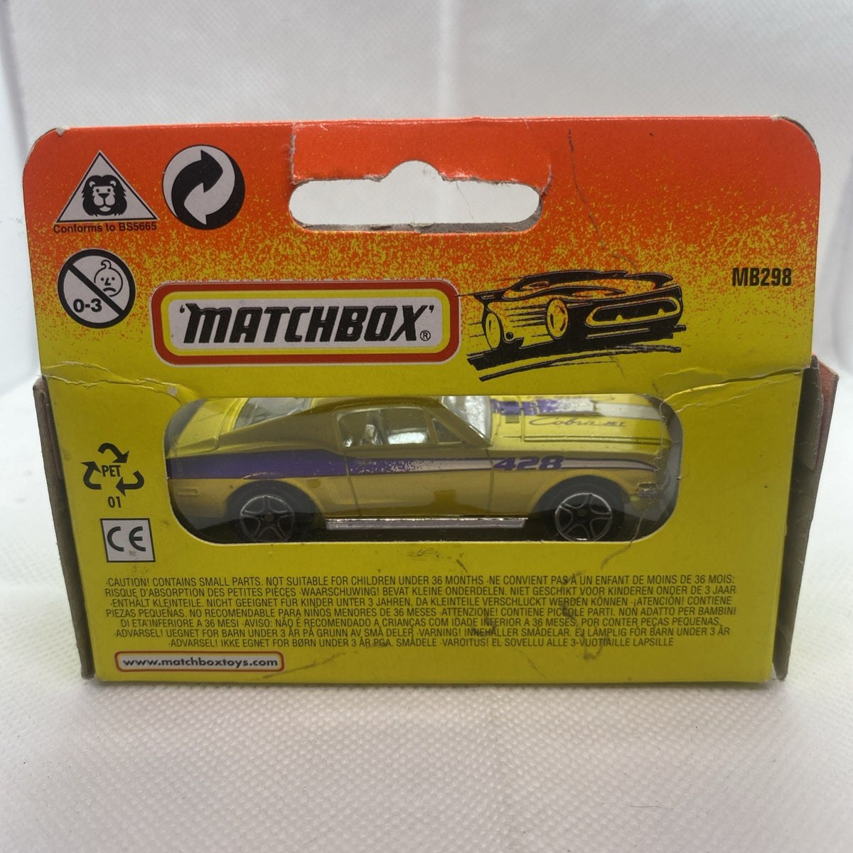 Boxed Matchbox die-cast yellow '68 Mustang Cobra Jet toy car, rear view on package