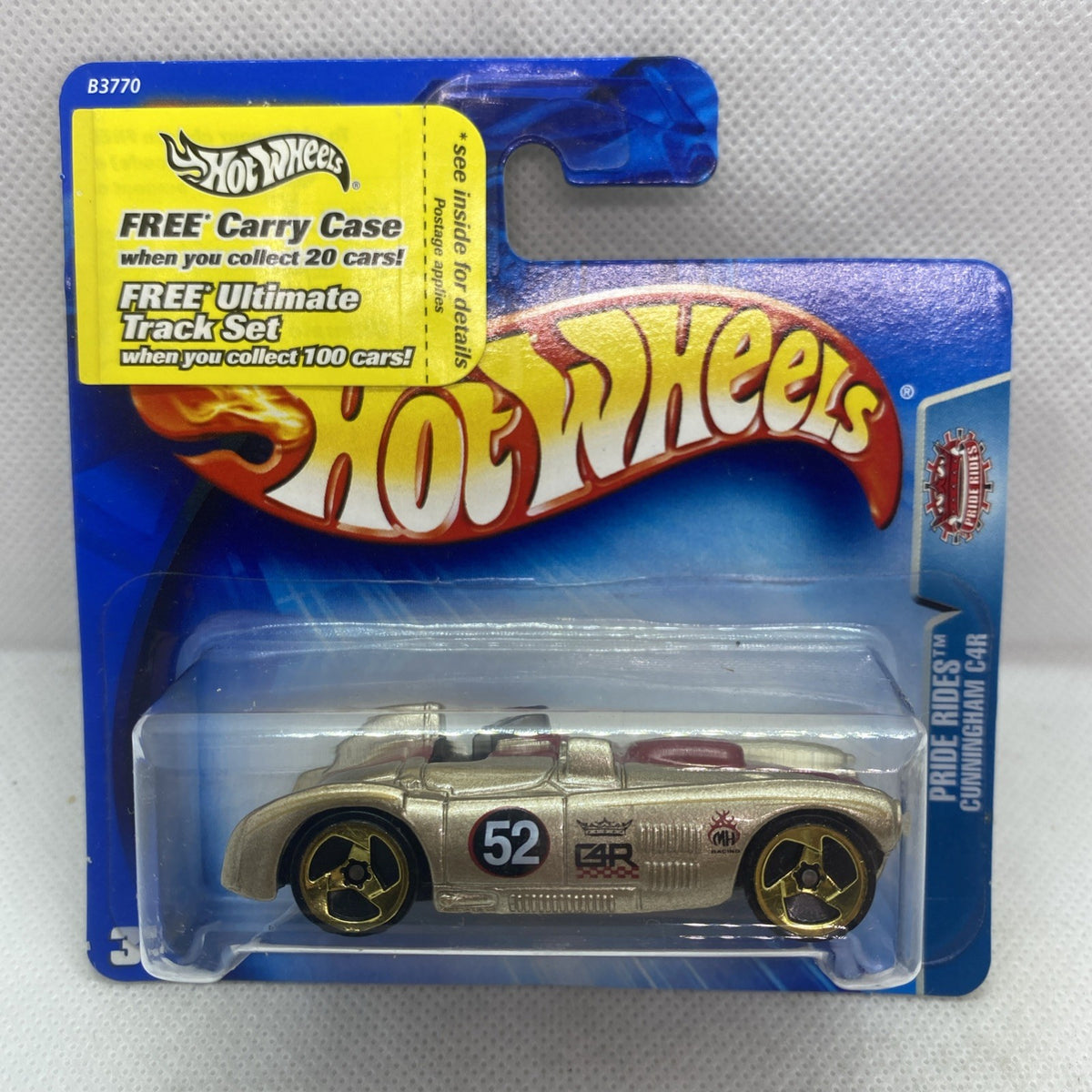 Hot Wheels blister pack showing gold die-cast race car on blue card backing