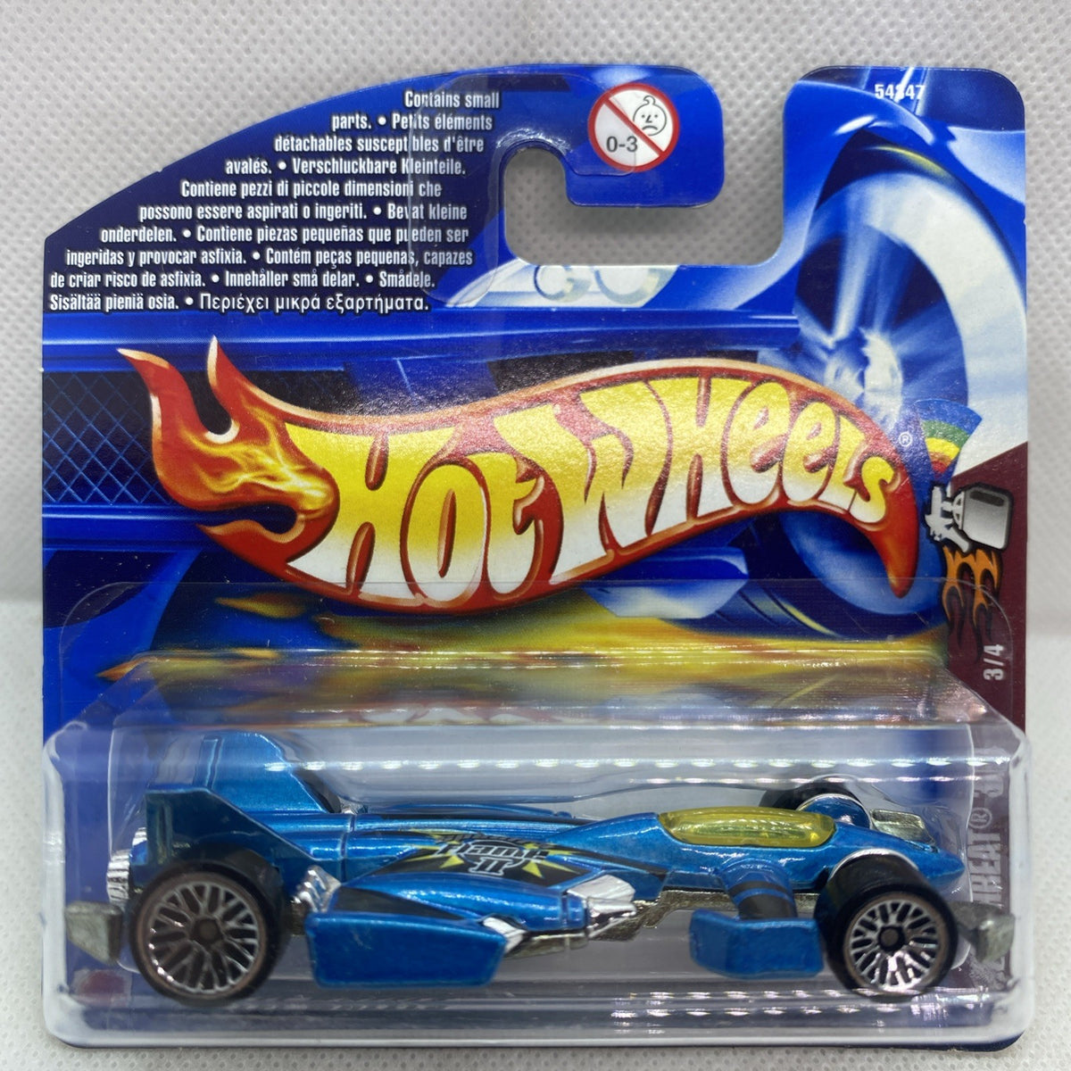 Blue and green die-cast race car in clear blister pack on blue card