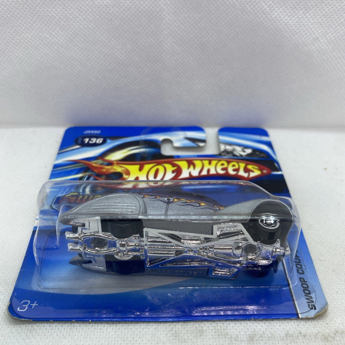 Gray and silver Hot Wheels Swoop Coupe toy car in sealed blister on blue card, #136.