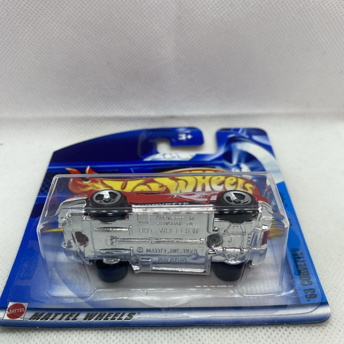 Hot Wheels Corvette die-cast in blister pack with silver undercarriage details