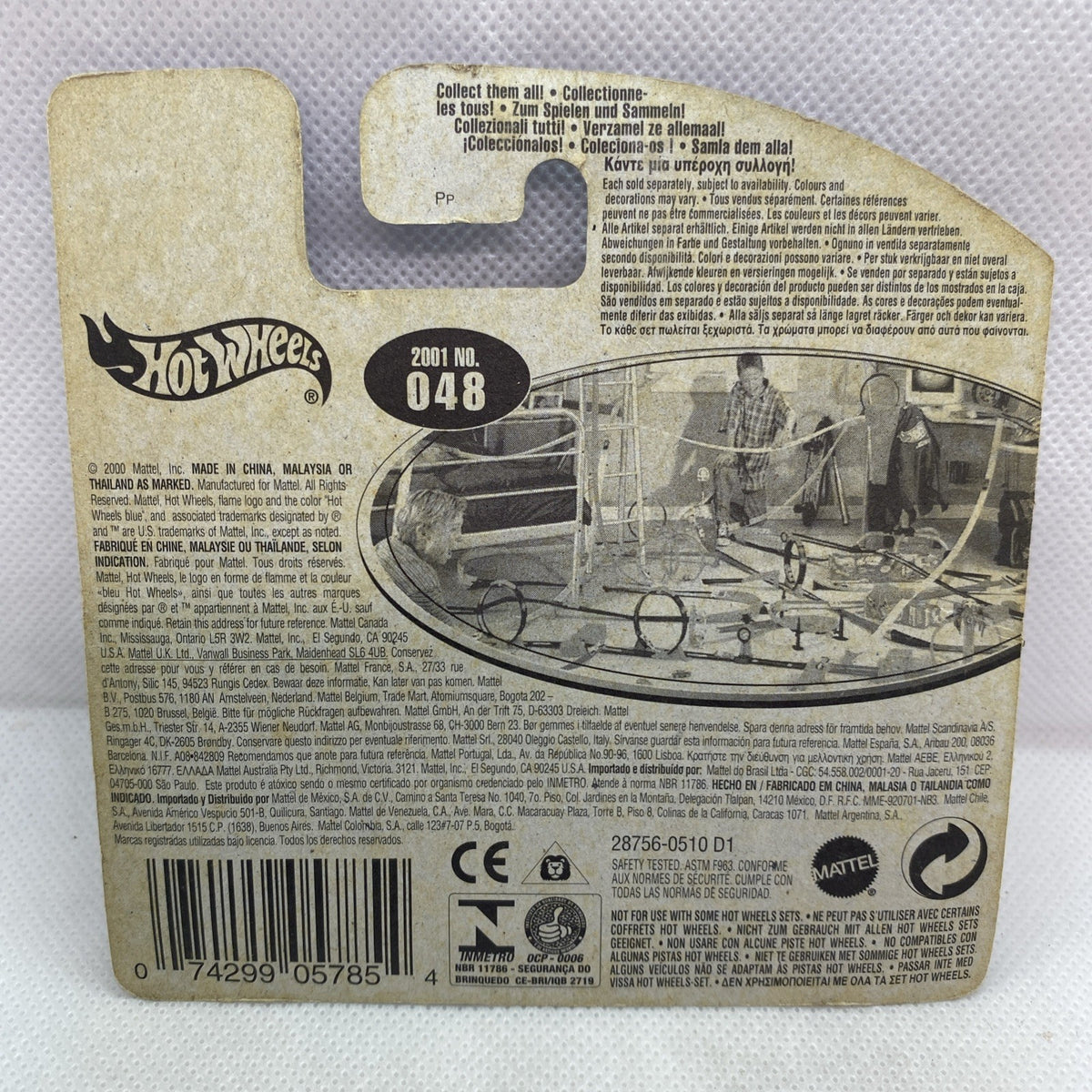 Hot Wheels card back with 2001 No. 048 label and barcode, text-filled packaging