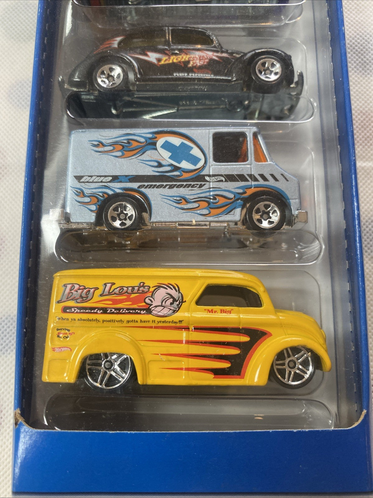 Hot Wheels Truck Stoppers 5-pack blister with black, blue, and yellow die-cast cars