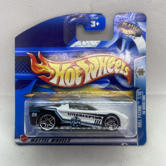 Hot Wheels Interceptor die-cast car on blue blister card, white with black details