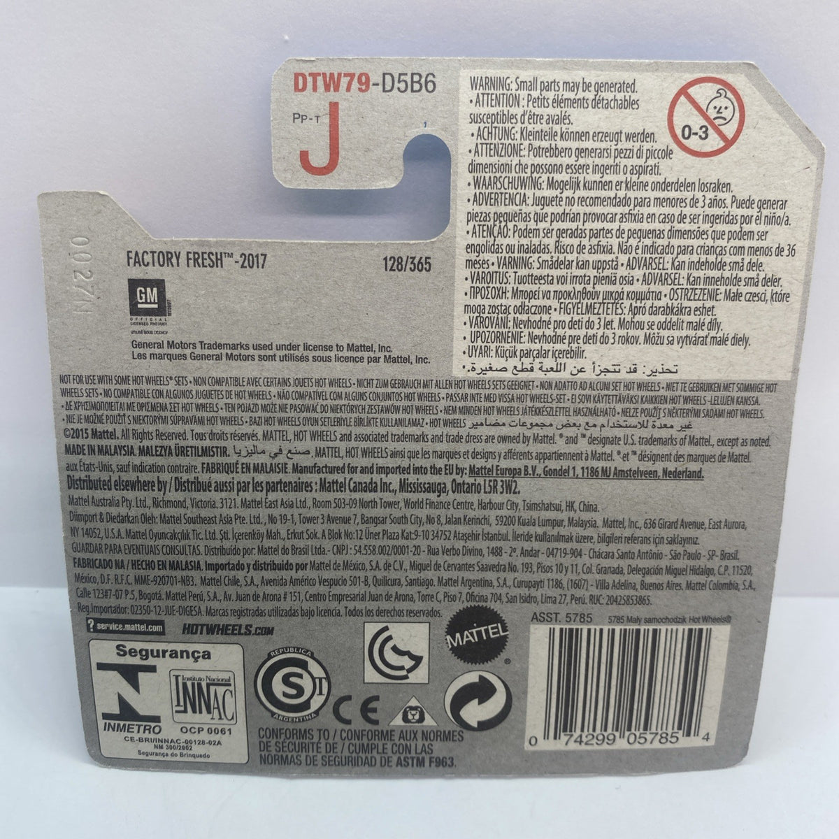 Hot Wheels diecast packaging back with model details, barcode, and safety icons