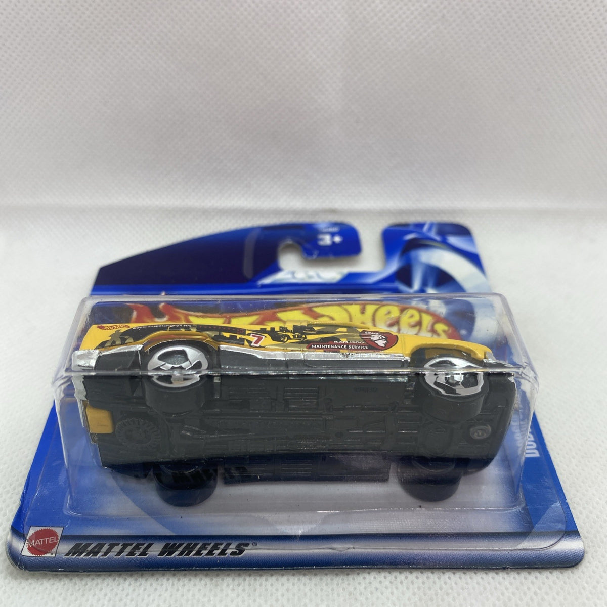 Hot Wheels Dodge Ram 1500 toy front view in blister, yellow body on card.